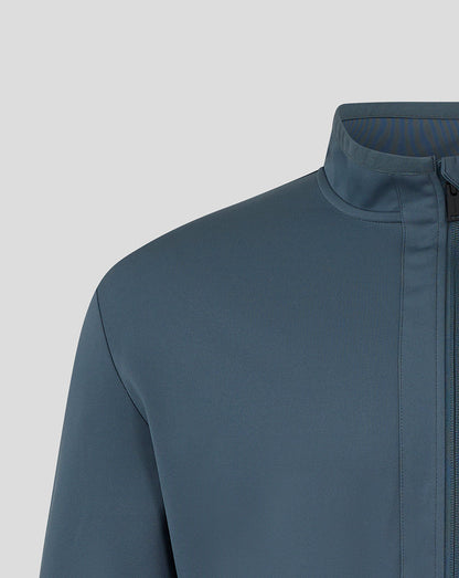 Shoulder sleeve close-up of Preston NE travel jacket with turquoise logo near cuff