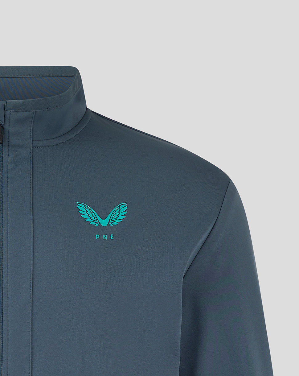 Close-up of Preston NE travel jacket chest area with turquoise PNE crest logo