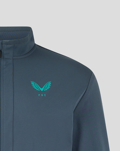 Teal wing crest and PNE letters on the chest of a navy Preston NE travel jacket
