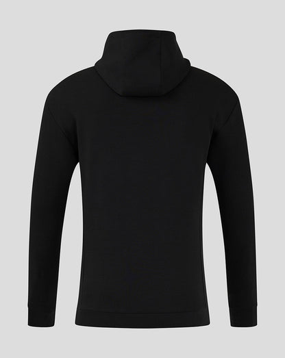 Back view of black Mansfield travel hoody with hood up and simple clean silhouette.