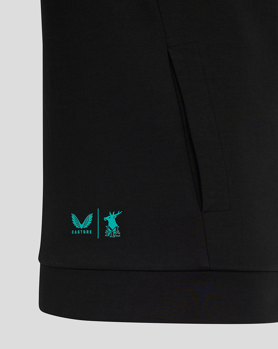 Bottom hem of black Mansfield travel hoody with turquoise Castore and stag logos.