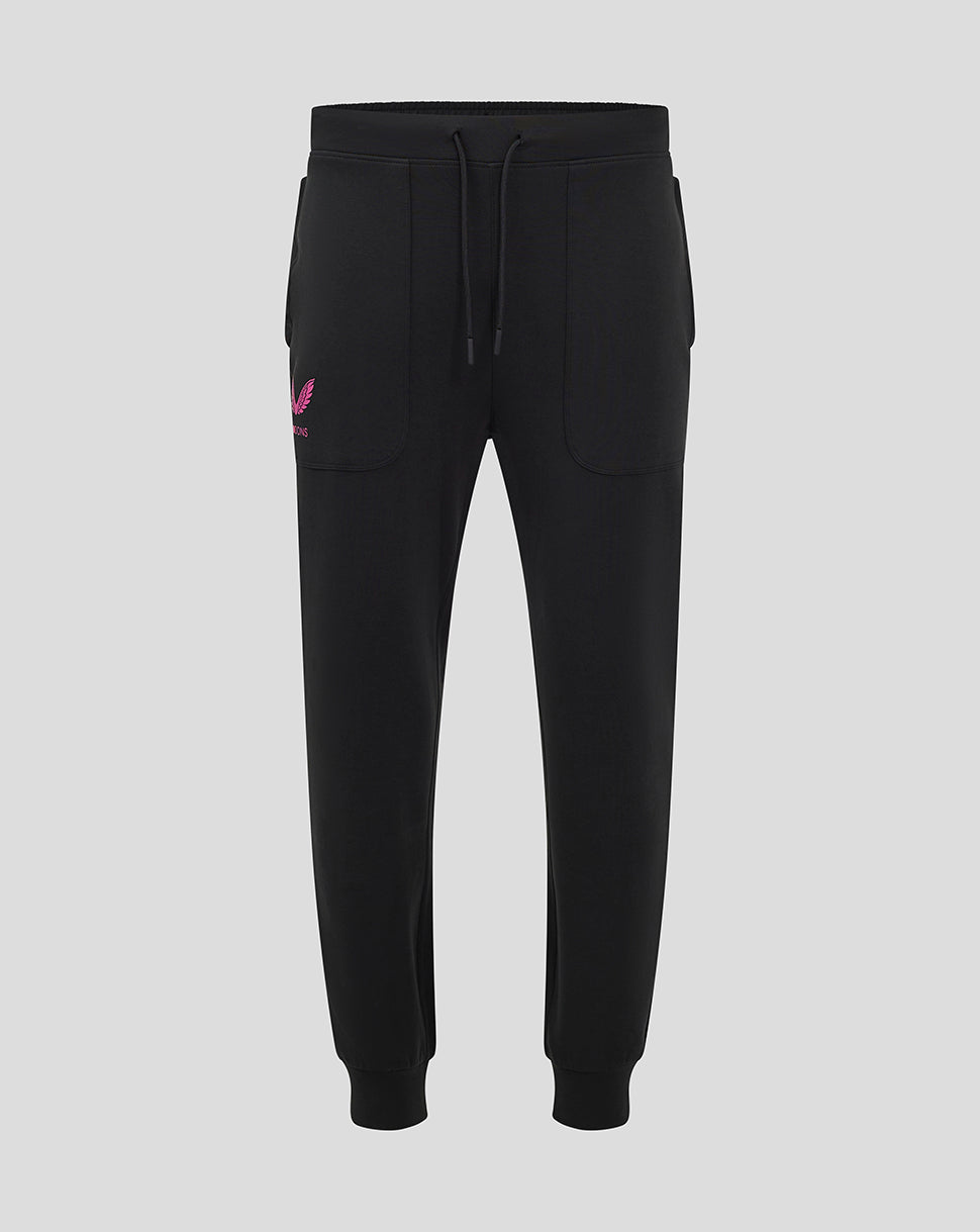 Front view of black Mk Dons travel pant with a drawstring waistband and a pink logo on the left thigh