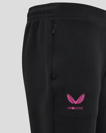 Close up of black Mk Dons travel pant showing side pocket and pink Mk Dons logo on the thigh.