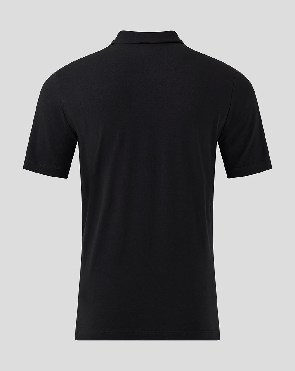 Back view of black MK DONS travel polo showing a plain back