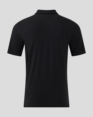 Back view of black MK DONS travel polo showing a plain back