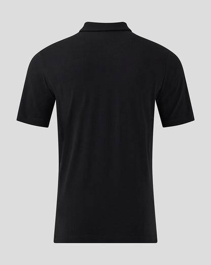 Back view of black MK DONS travel polo showing a plain back