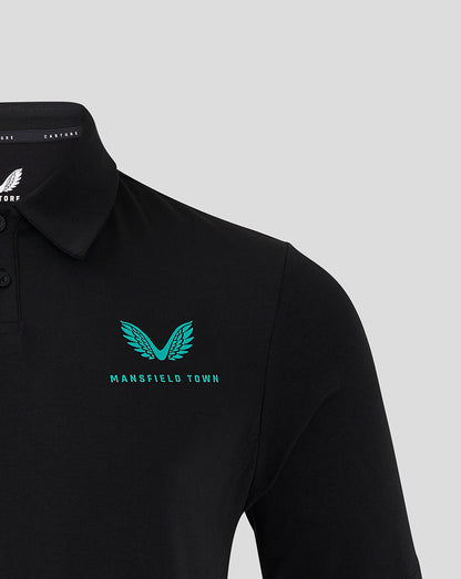 Close up of teal wing logo and Mansfield Town text on black polo chest