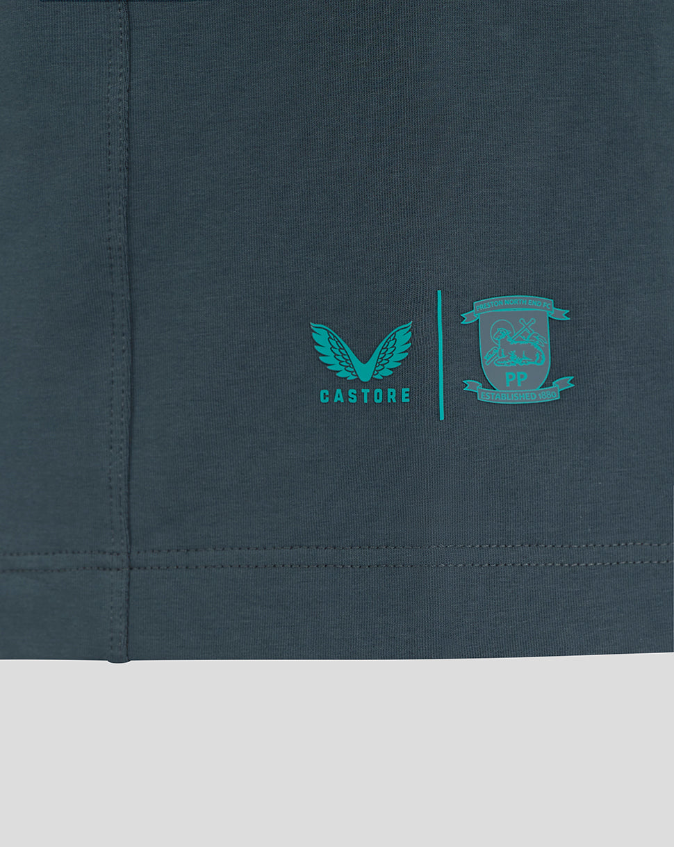 Close-up of Castore and Preston North End crest logos on the polo lower left hem