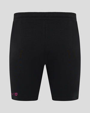 Back view of black Mk Dons travel shorts with pink logo near the hem