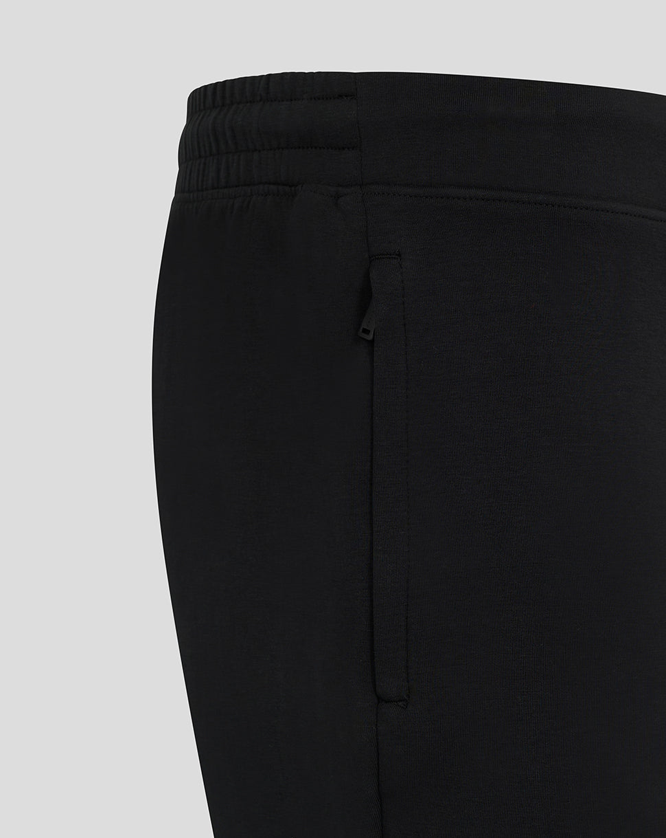 Side view of black Mk Dons travel shorts showing a zip pocket.