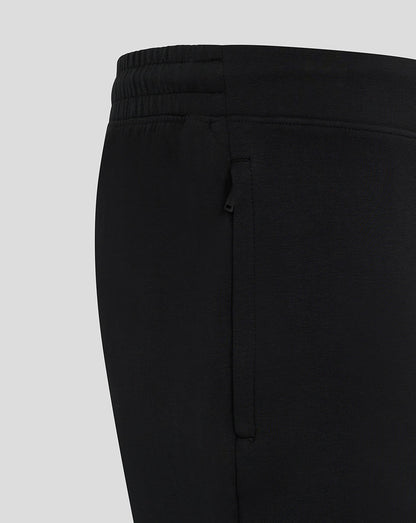Side view of black Mk Dons travel shorts showing a zip pocket.
