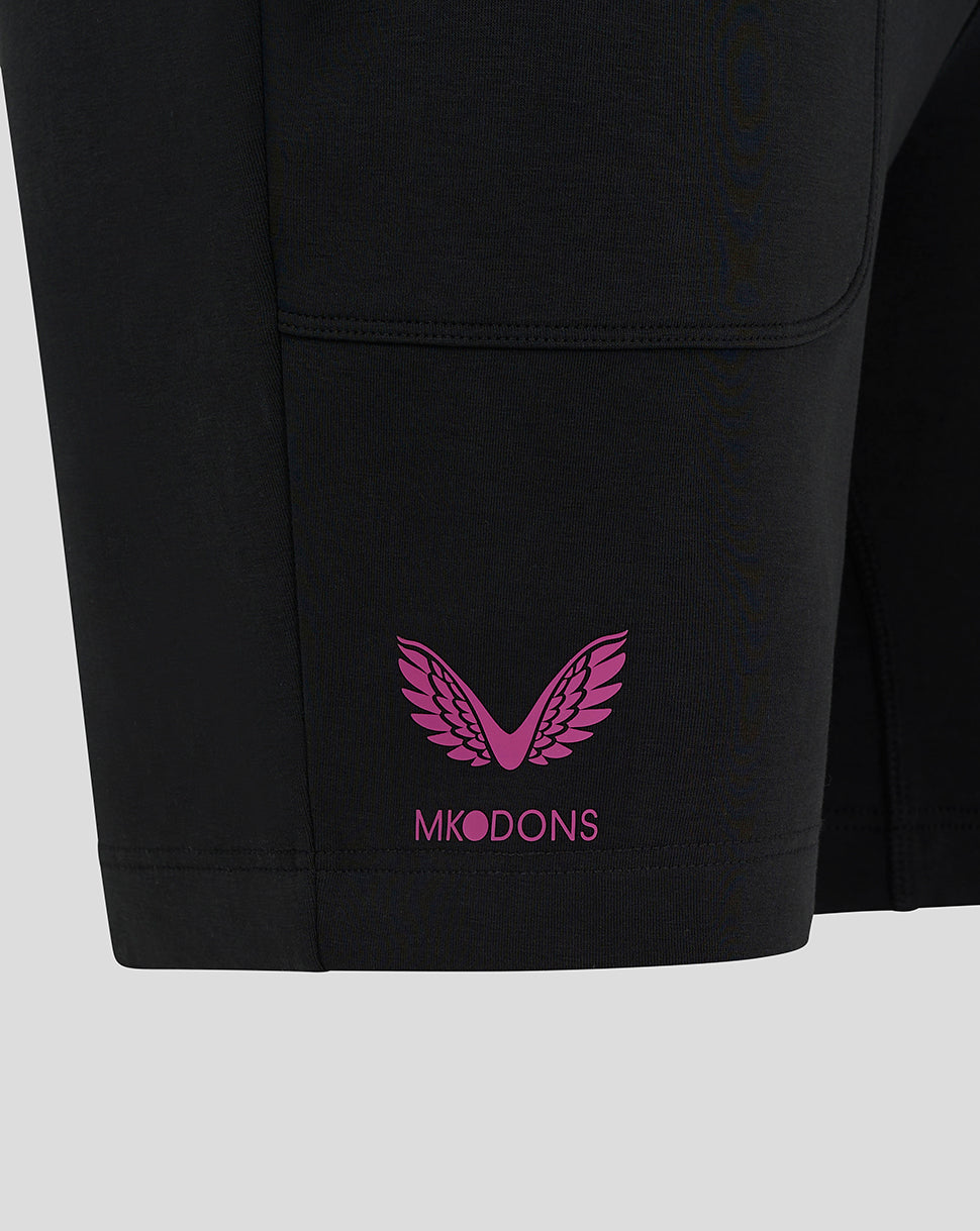 Pink MK DONS wing logo on the hem of black travel shorts.