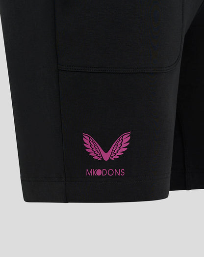Pink MK DONS wing logo on the hem of black travel shorts.