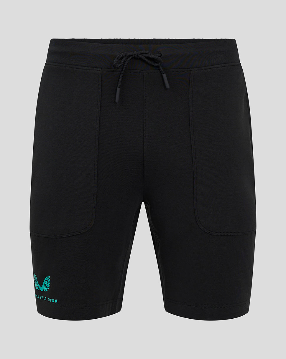 Front view of black Mansfield Men's 24/25 Travel Shorts with drawstring waist and teal logo on the left leg.