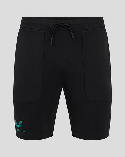 Front view of black Mansfield Men's 24/25 Travel Shorts with drawstring waist and teal logo on the left leg.