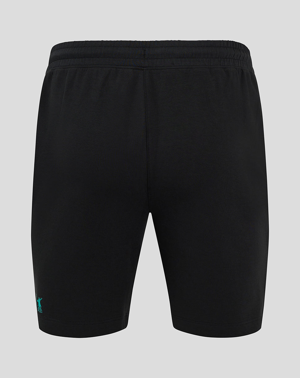 Back view of black shorts with elastic waistband and small teal logo at the lower left leg