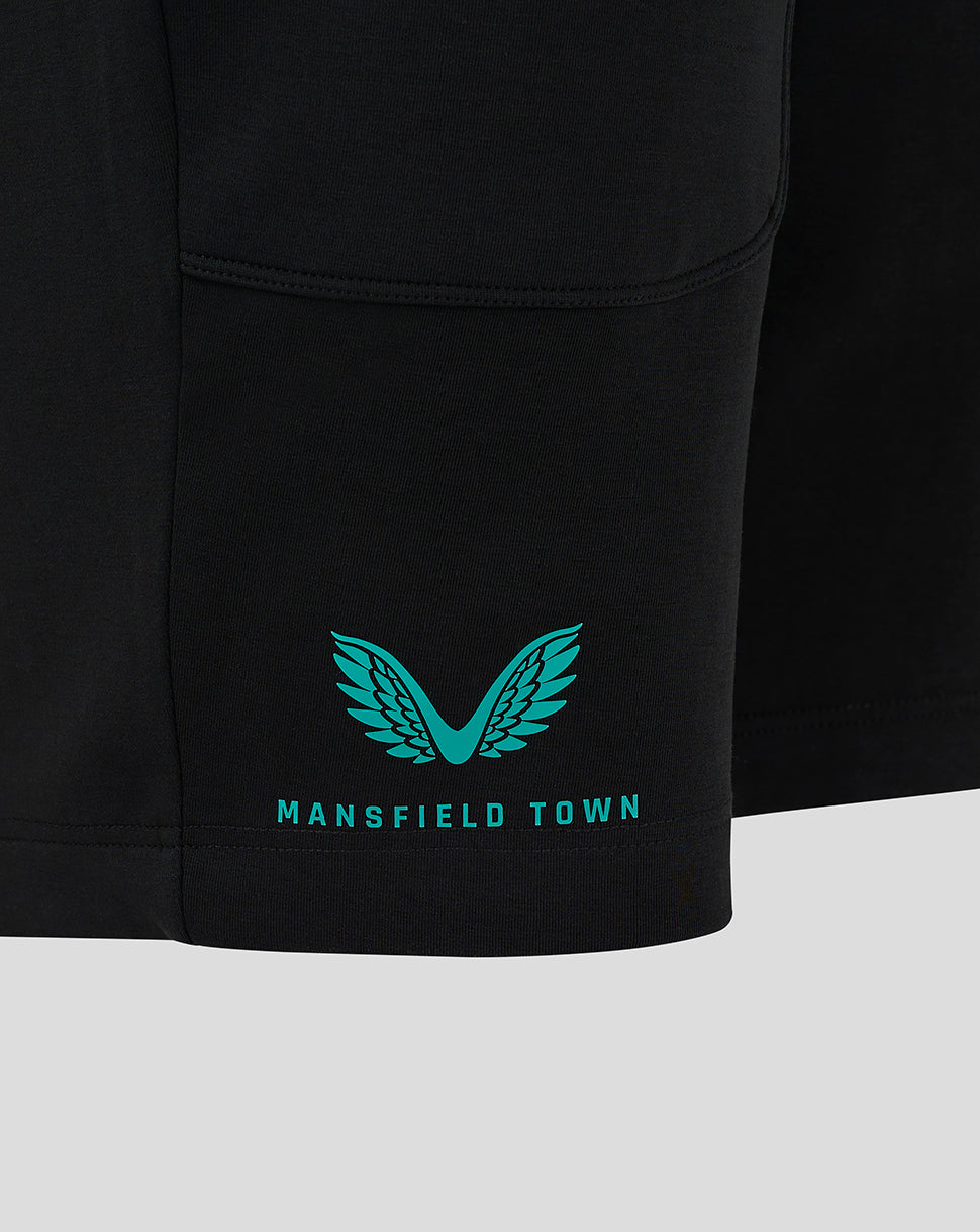 Close-up of black Mansfield travel shorts with teal wing logo and Mansfield Town text at the hem