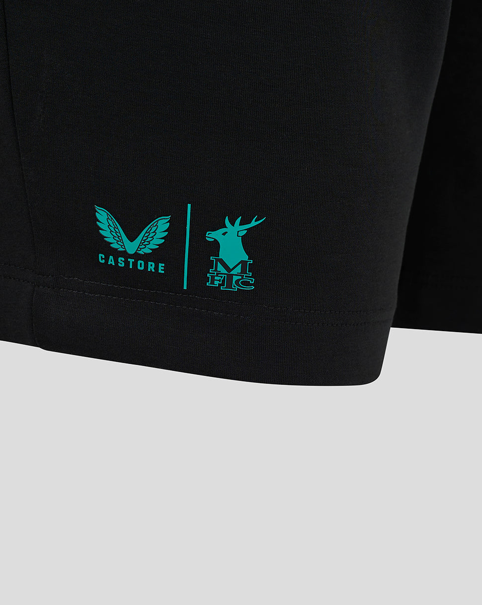 Teal Castore logo and a teal deer crest with MFC initials on the side of black shorts