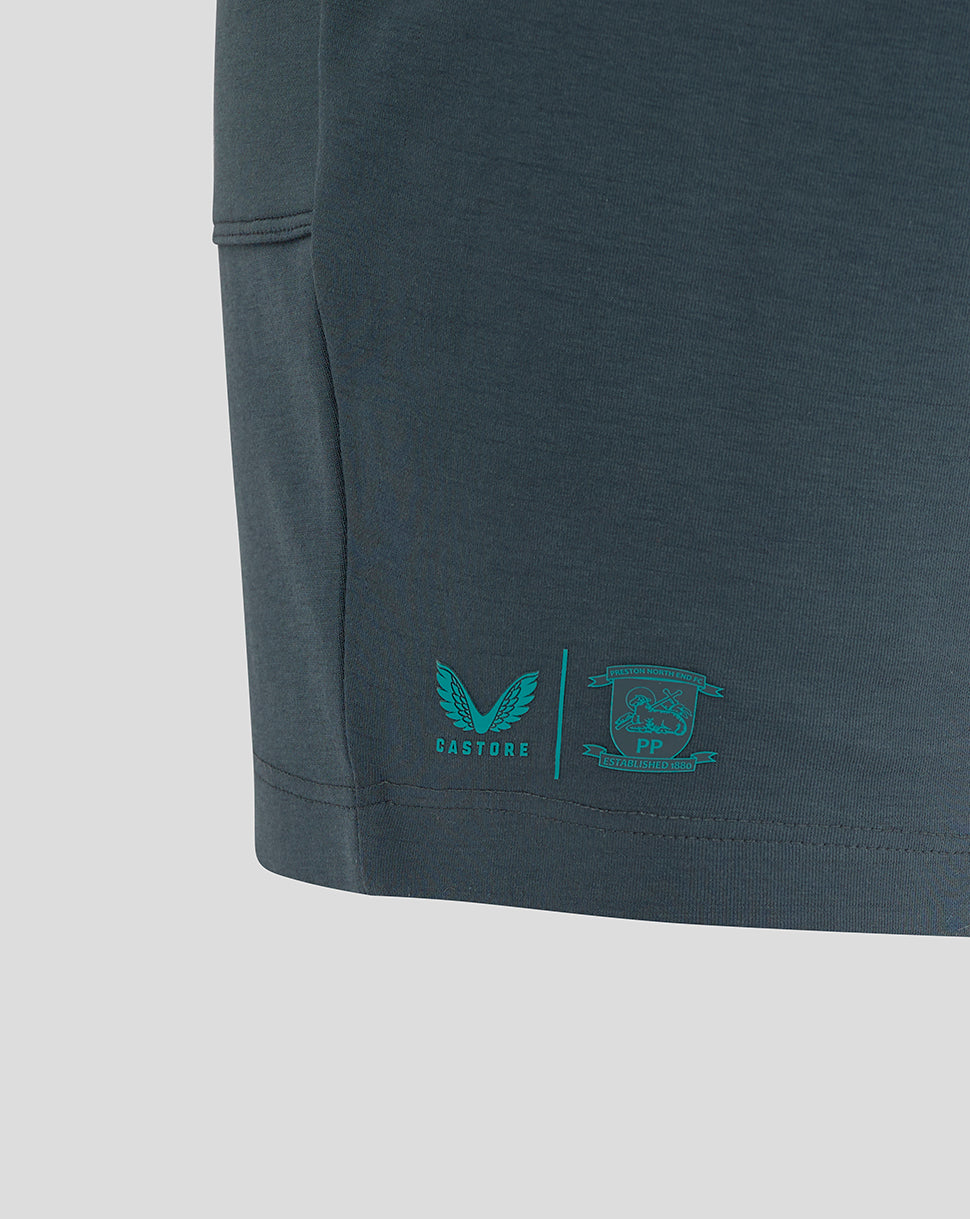 Rear left hem shows teal PNE crest and Castore logo on Preston NE Travel Shorts.