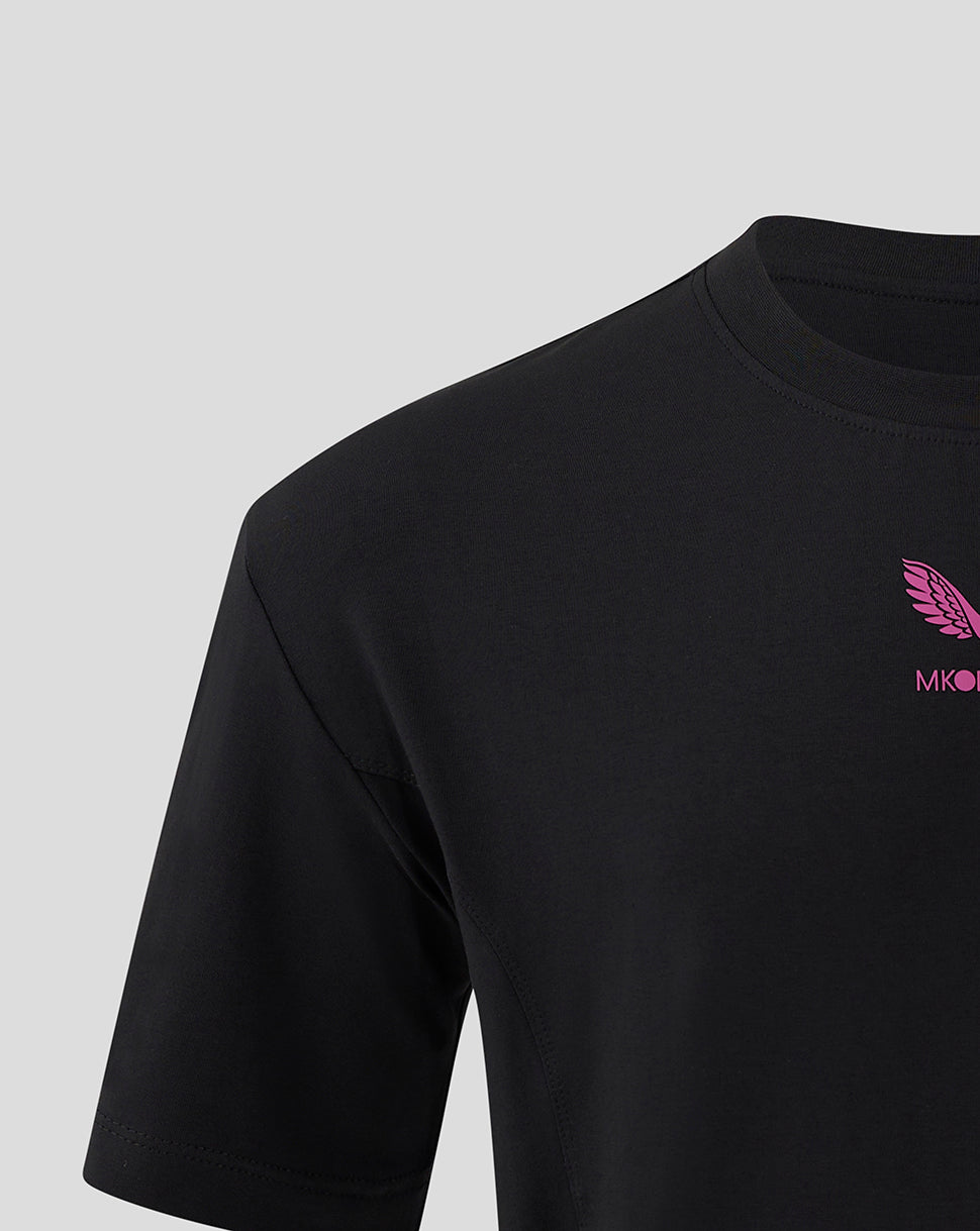 Left shoulder close up of black Mk Dons Travel T Shirt with pink wing logo on the chest