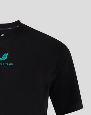 Mansfield Men's 24/25 Travel Tee in black with turquoise wing logo on the chest