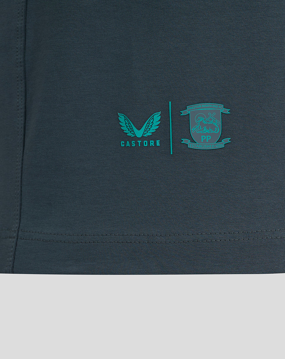 Lower chest area showing teal Castore logo and Preston North End crest separated by a vertical line on a dark teal T shirt