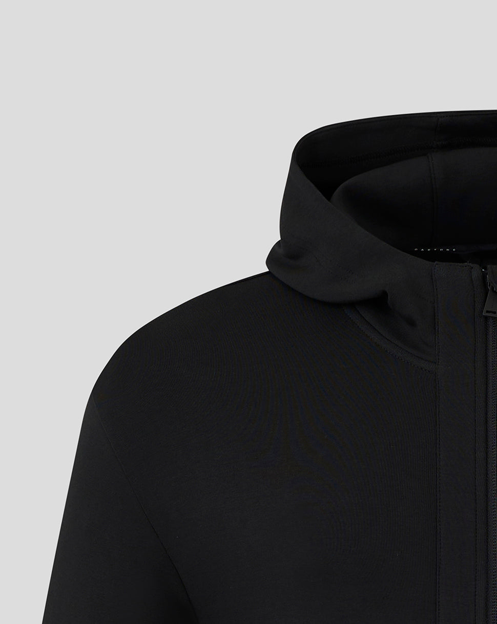 Close up of a black Mansfield hooded travel jacket showing the hood and shoulder area.