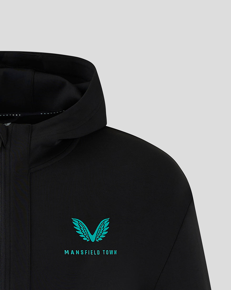 Black Mansfield hooded travel jacket close up of teal winged logo on chest
