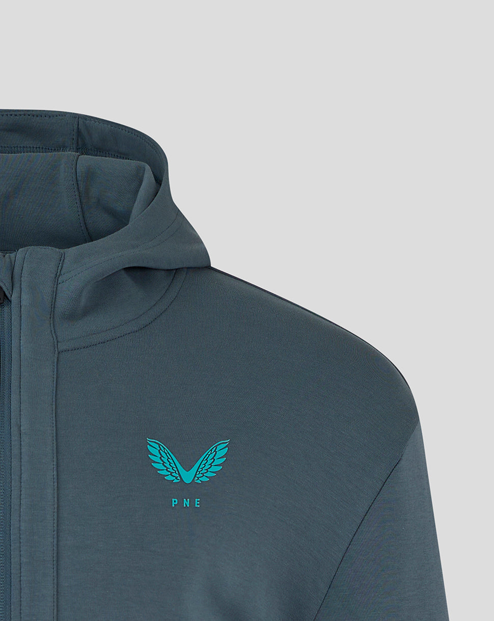 Preston NE hooded travel jacket close up of left chest turquoise PNE crest with wings and Castore logo at hem