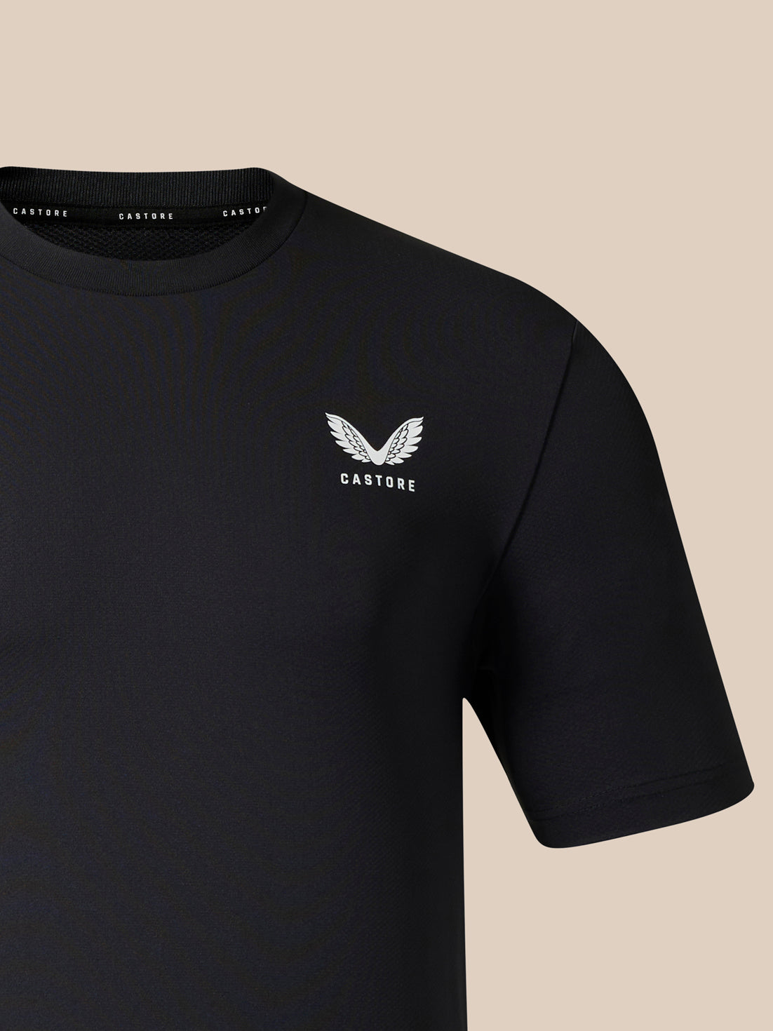 Black men's short sleeve T-shirt with white wing logo and CASTORE text on the chest.