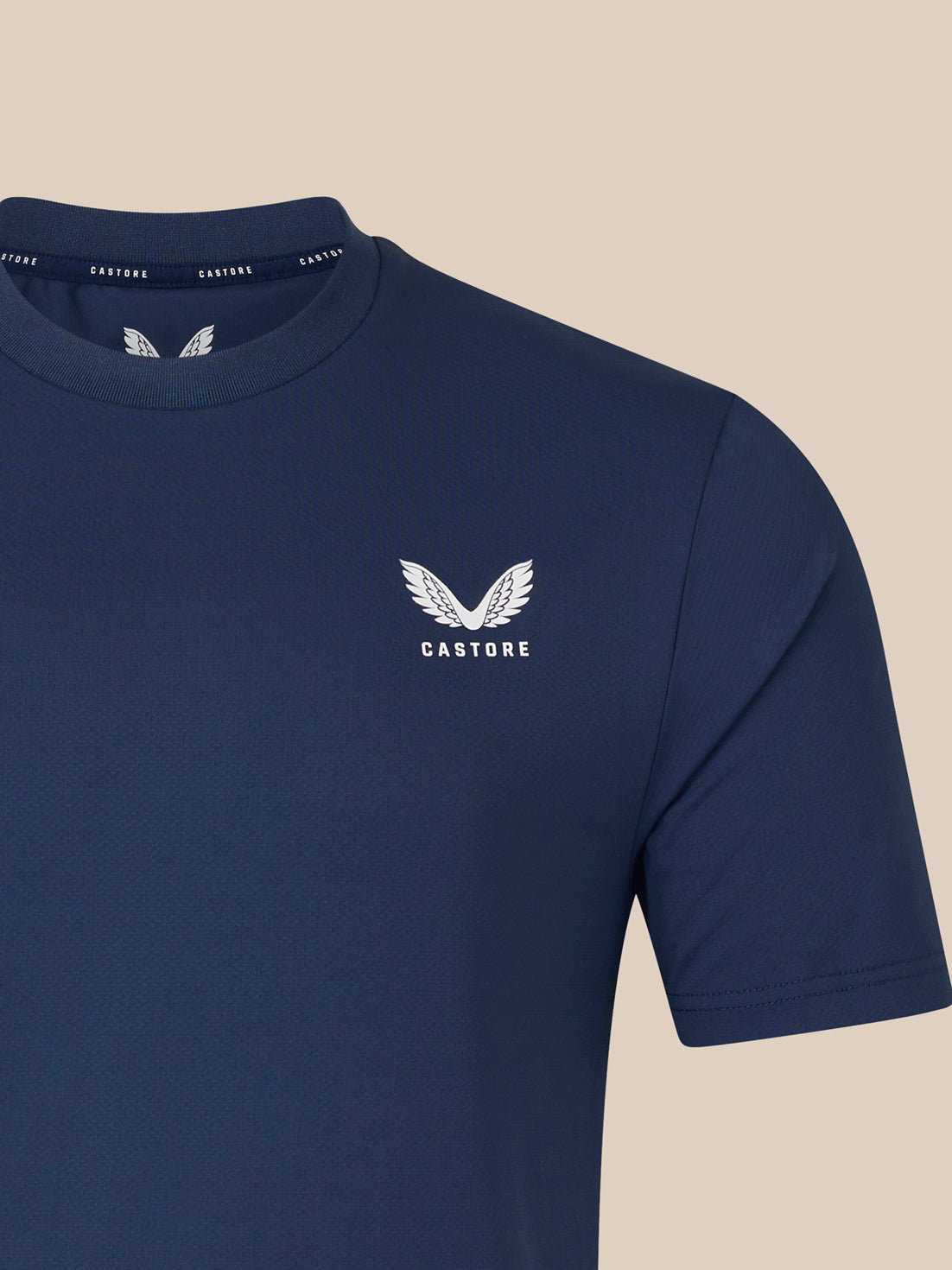 Front view of navy men's short sleeve T shirt with white crest logo on left chest
