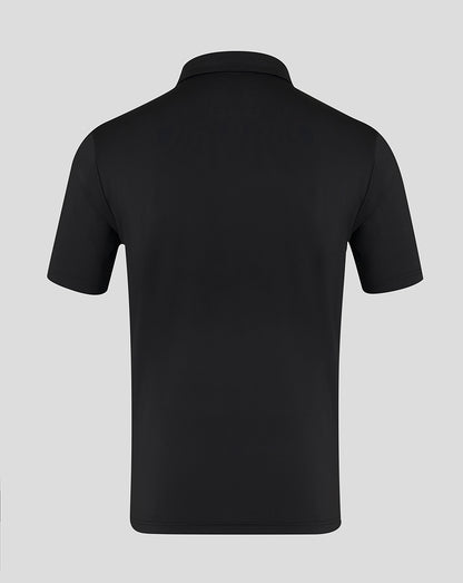 Back view of a black short sleeve polo shirt with clean minimal design and classic collar
