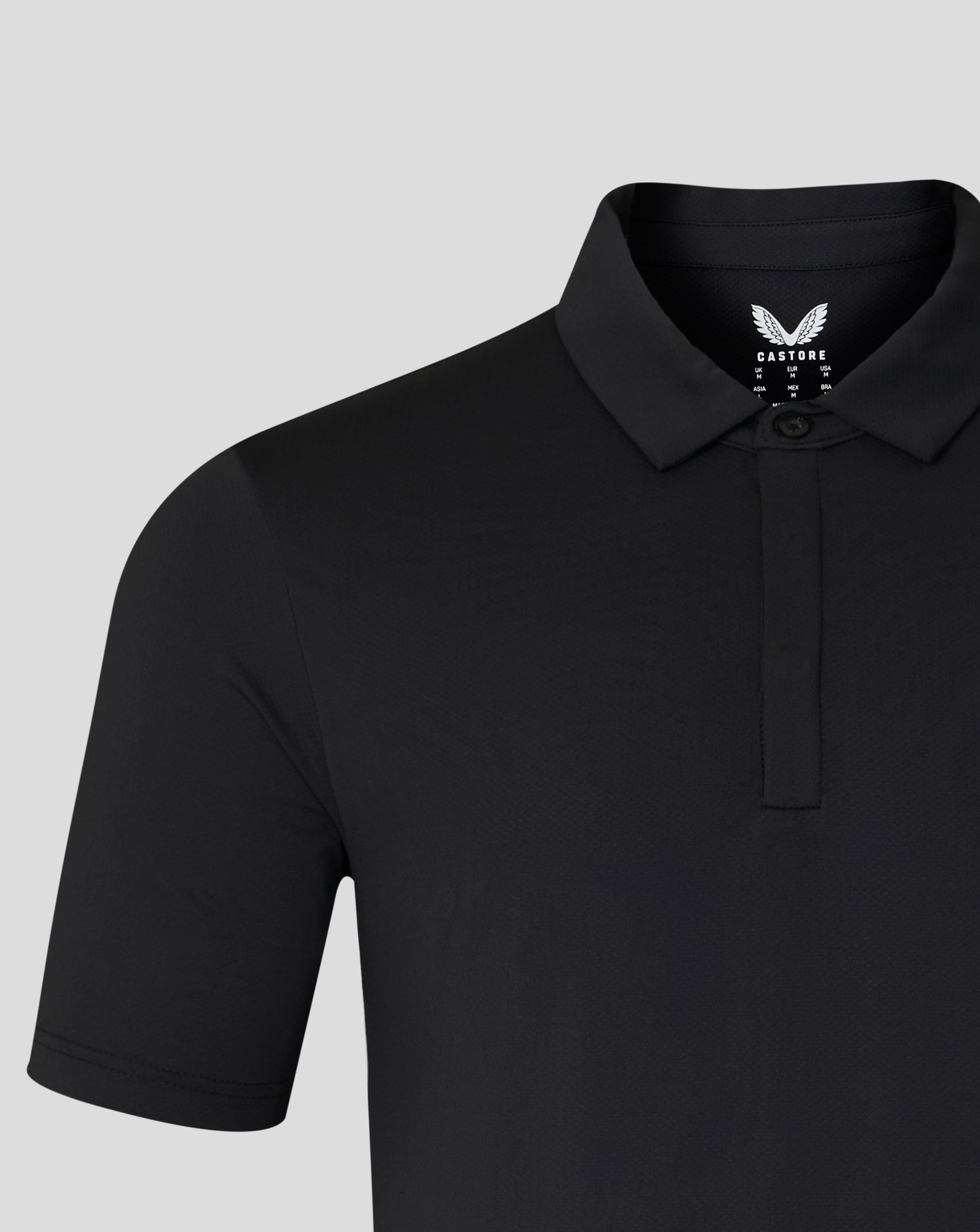 Black Castore polo with embroidered logo on left chest and button placket