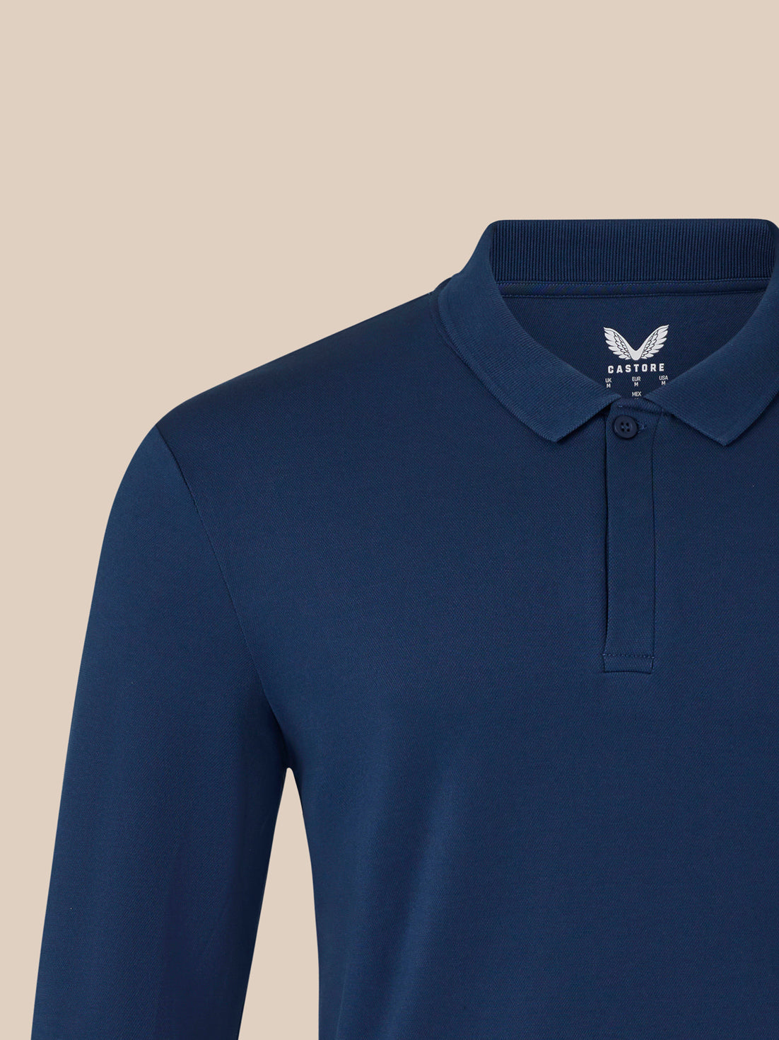 Close up of navy polo collar with ribbed knit and single button placket