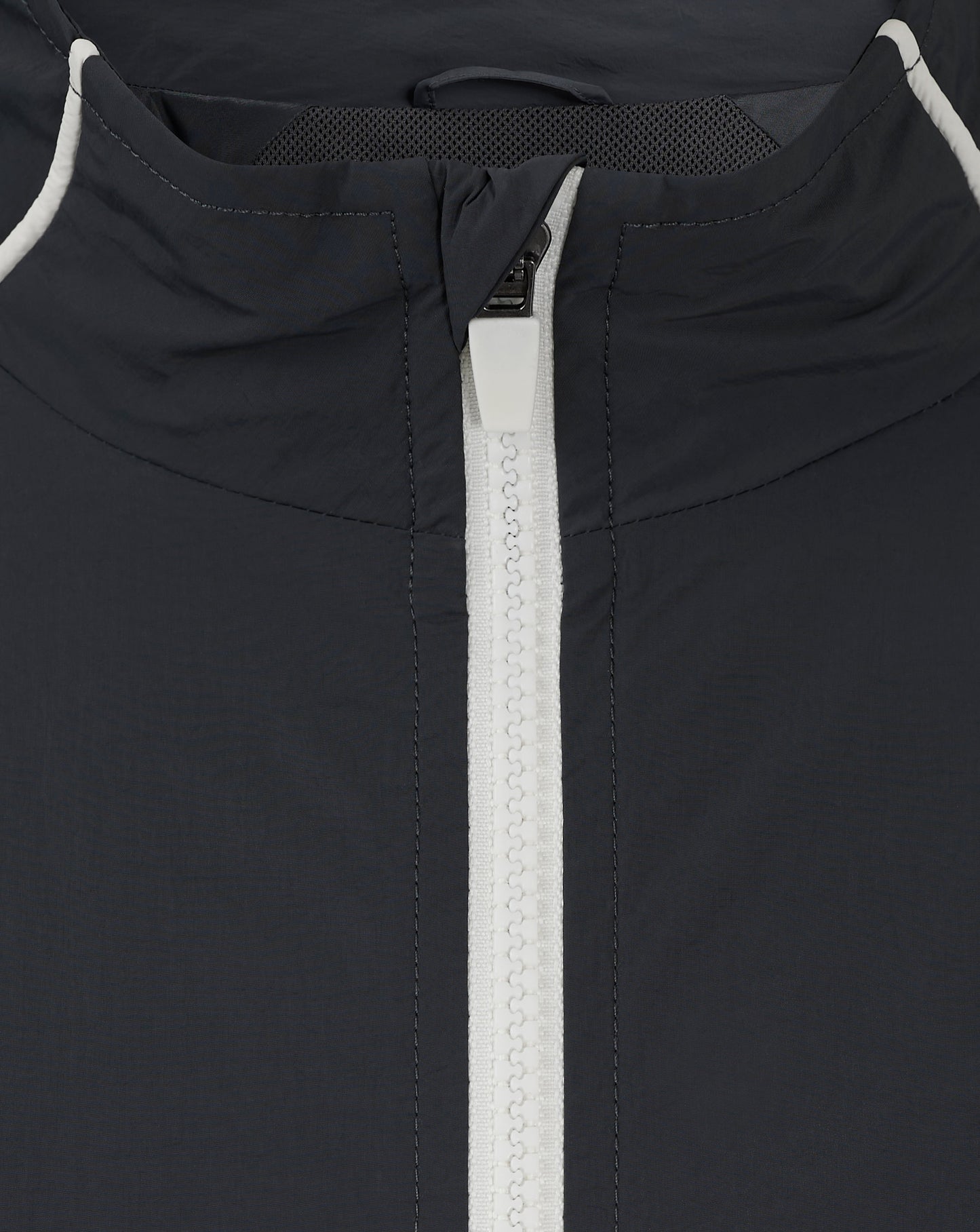 Back neck close-up of navy Rangers track jacket with white piping and exposed zipper