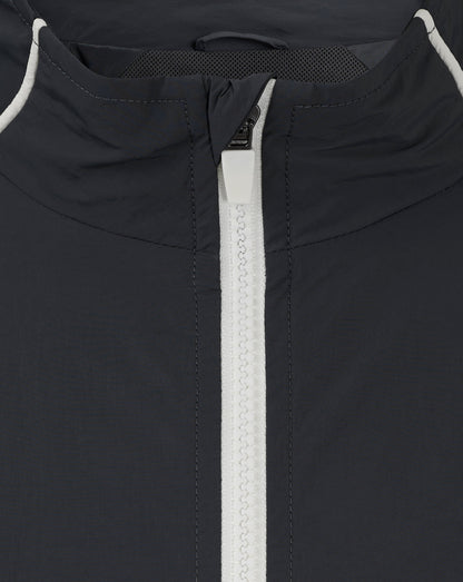 Back neck close-up of navy Rangers track jacket with white piping and exposed zipper