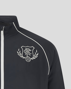 Close up of navy Rangers Track Jacket showing the embroidered crest on the chest and white piping along the shoulder