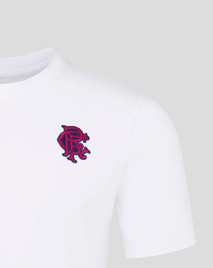 Close up of blue red embroidered Rangers crest on white Junior Core Fan Crest Top