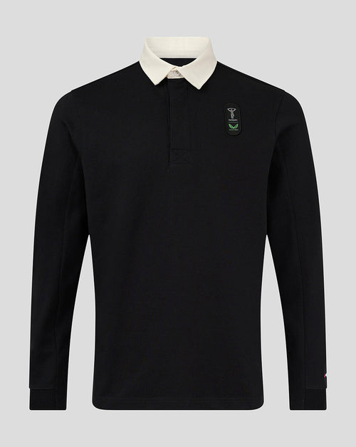 Front view of a black Harlequins junior dual branded jersey top with a white collar and left chest crest.