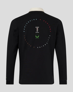 Back view of black Harlequins dual branded jersey top with cream collar and circular graphic on the back.