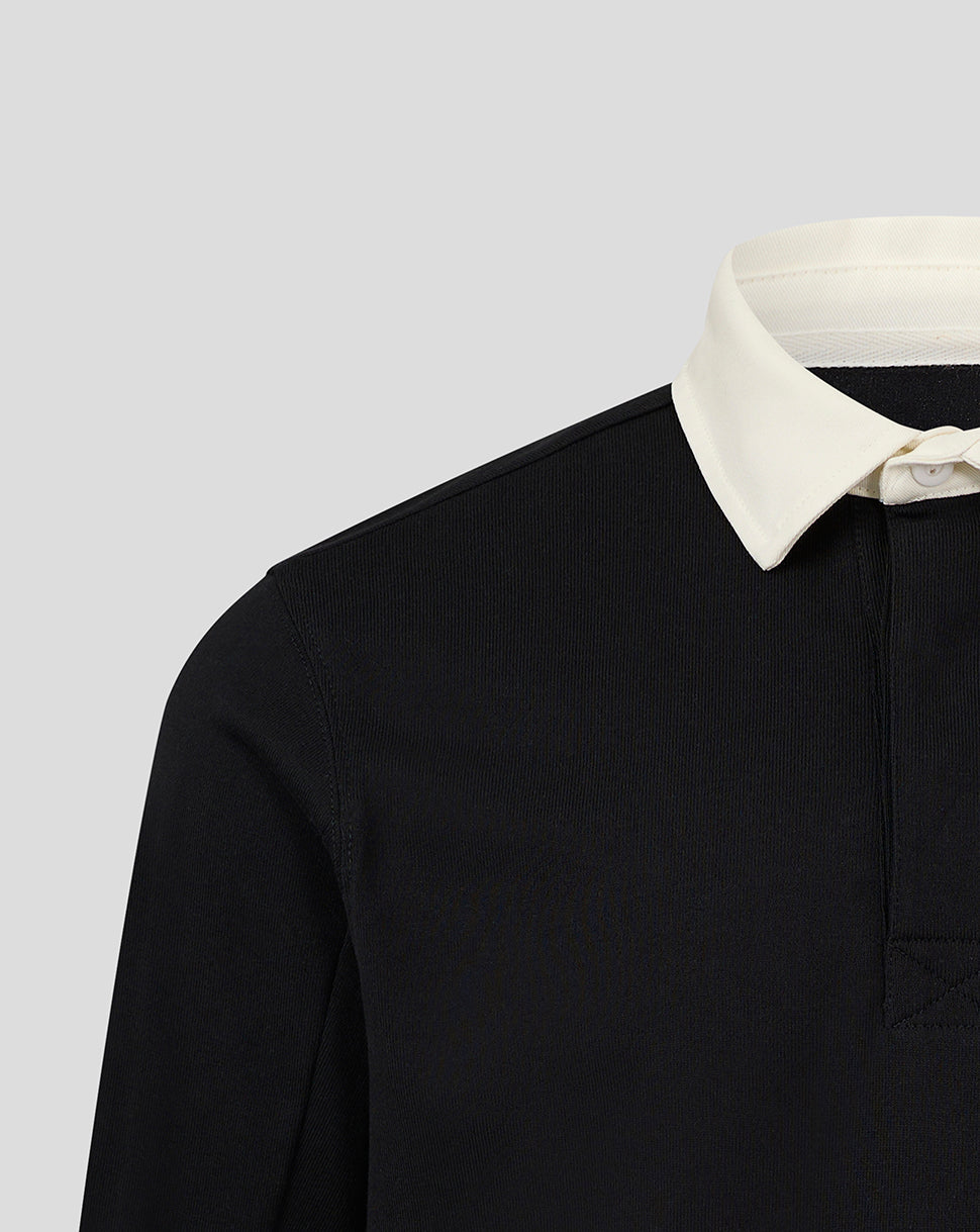 Shoulder and collar area of black rugby jersey with cream white collar.