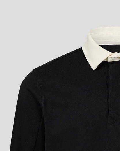 Shoulder and collar area of black rugby jersey with cream white collar.