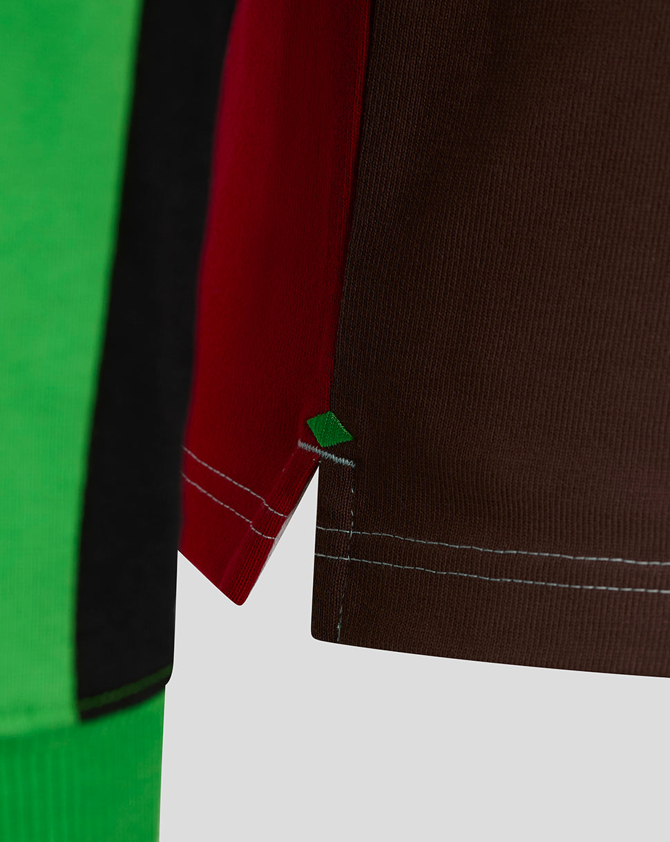 Color-block Harlequins rugby shirt with brown red panels and a small green diamond accent at the hem.