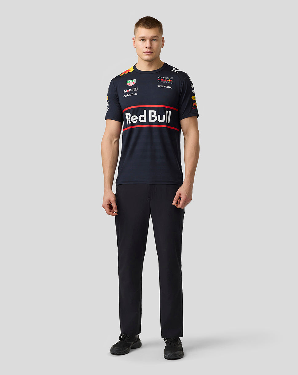 Full body view of male model in navy Red Bull Racing Set Up T Shirt with large Red Bull graphic across the chest and logos on sleeves