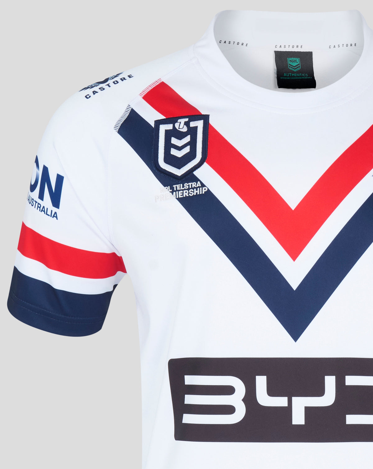 Sydney Roosters away jersey close up of shield crest on bold chevron design near the chest