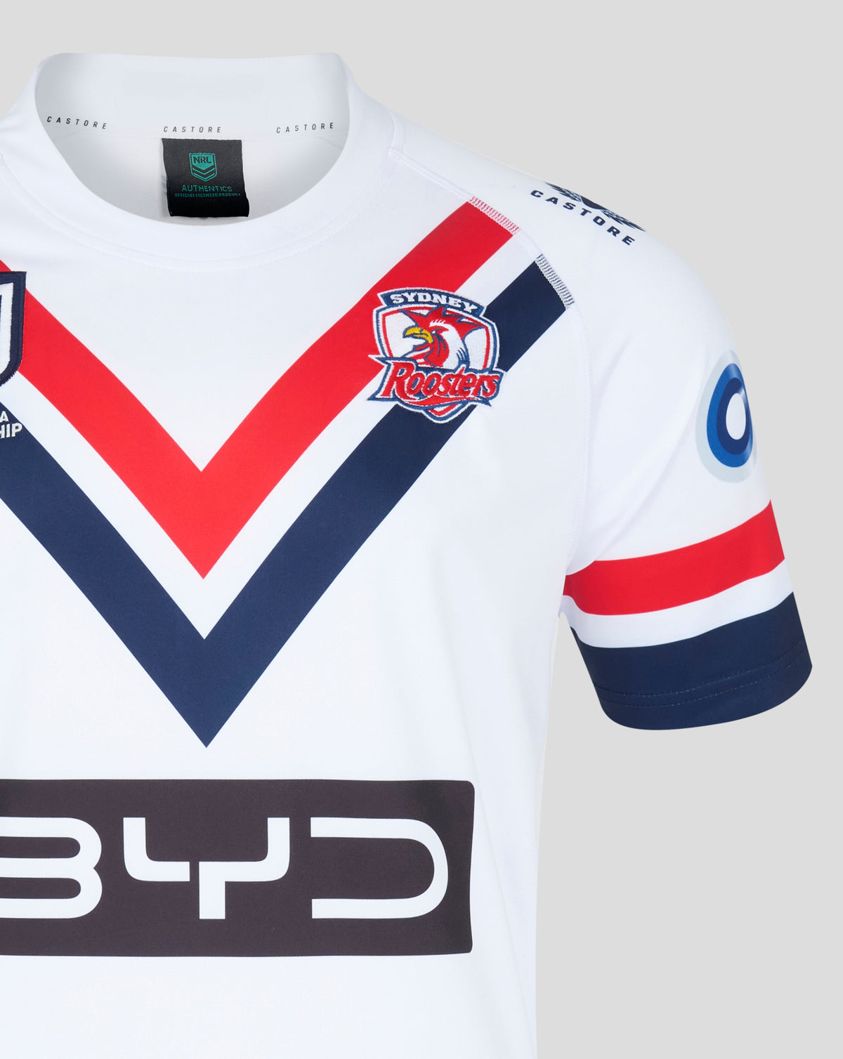 Sydney Roosters away jersey close up showing collar tag and team crest with red navy chevron pattern