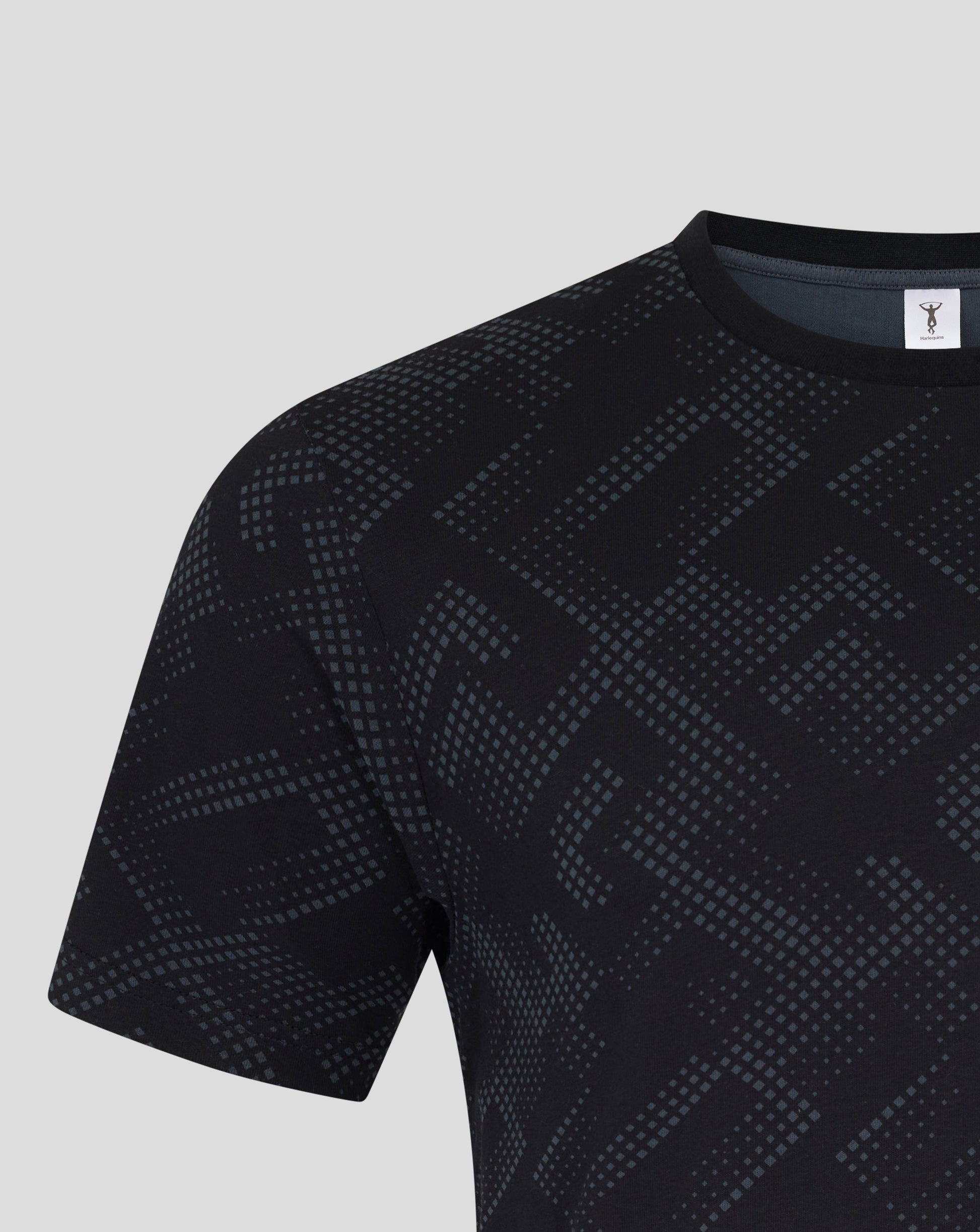 Close up of navy Harlequins men's short sleeve pajama top with a geometric square pattern