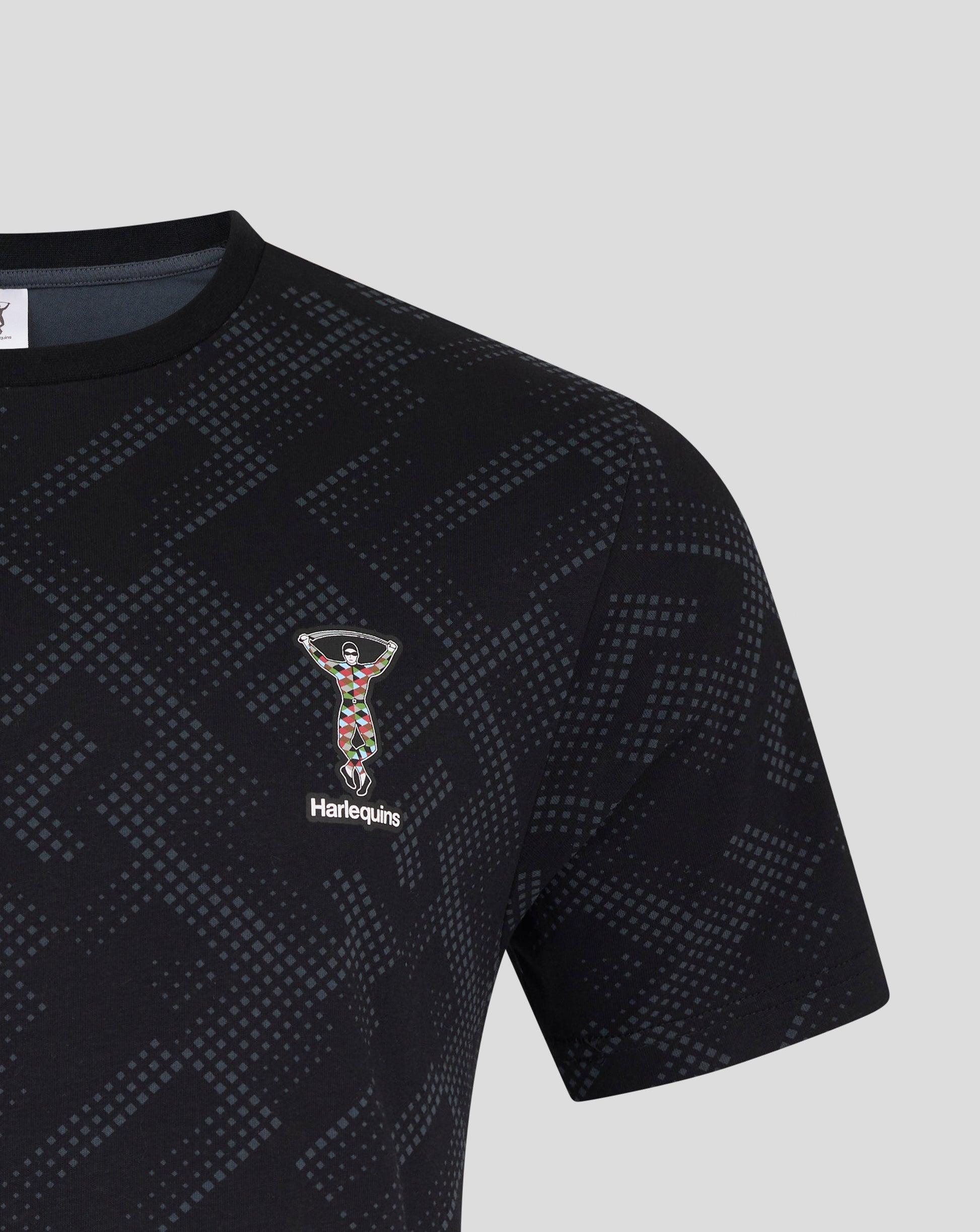 Front view of navy Harlequins pajama top with dotted geometric print and Harlequins logo on chest