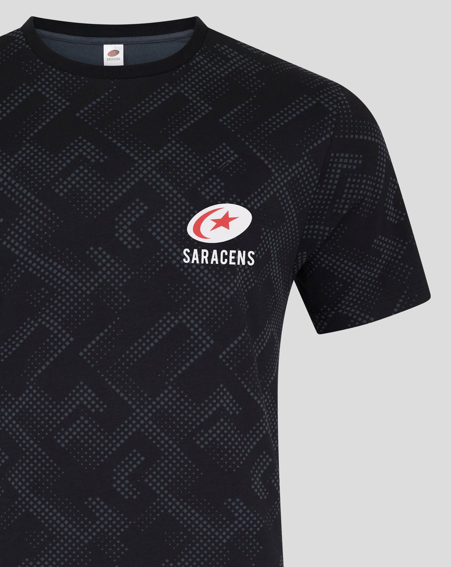 Front view of black shorts showing the Saracens logo near the lower left leg and the dotted pattern