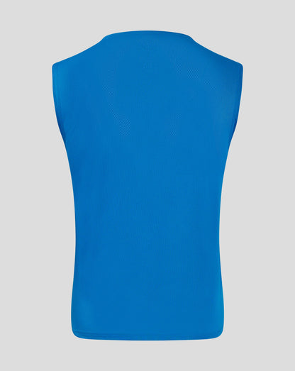 Back view of blue junior training bib in mesh fabric with scoop neckline and binding at armholes